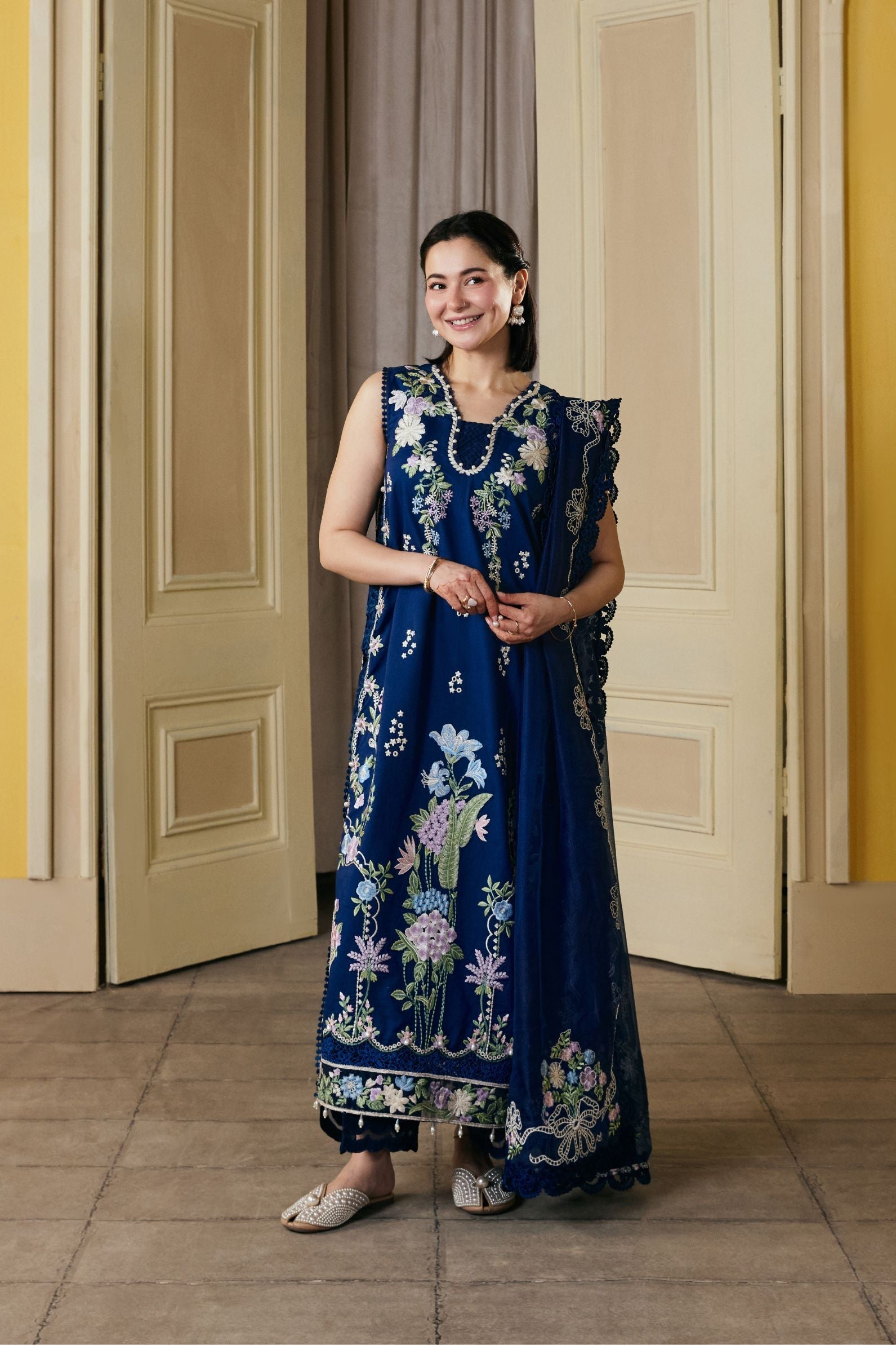 hania amir blue dress haniaheheofficial served major wedding guest goals as she stunned in a dreamy metallic blue lehenga by @itrhofficial , worth 1,70,000. With golden threadwork, her look was pure royalty, paired with a radiant
