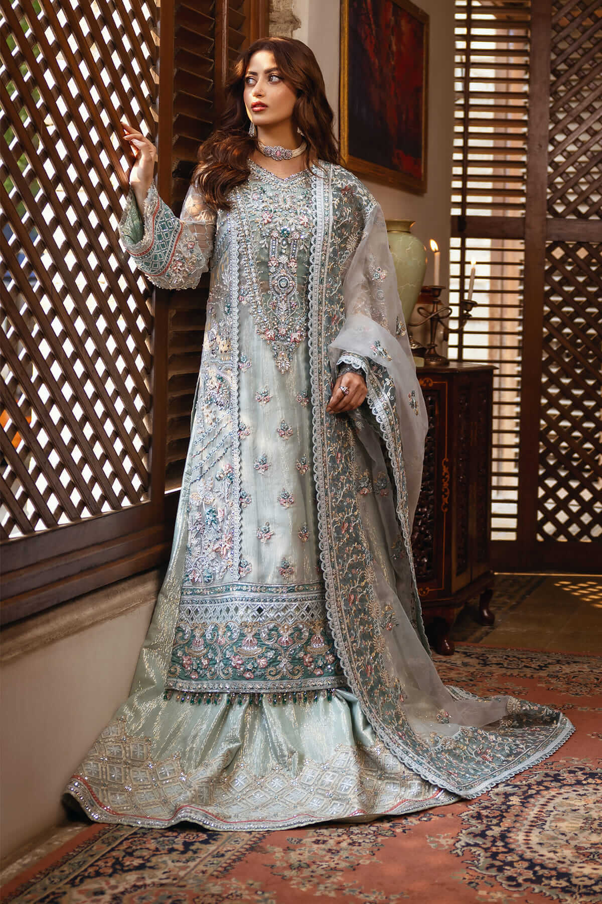 sajal aly wedding dress designer sajalaly embodies bridal royalty in this breathtaking creation by Hussain Rehar. Draped in a deep, luxurious red, the satin silk lehenga is adorned with intricate adda work featuring sequins, bugle beads, resham,